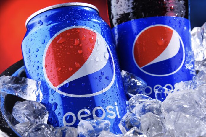 Bottle and can of Pepsi in bucket with crushed ice