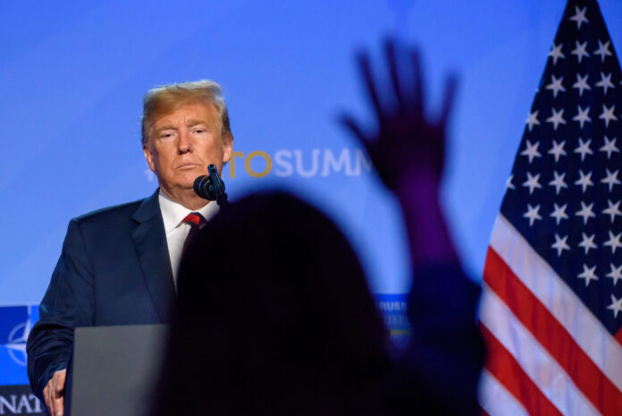 trump audience hand up