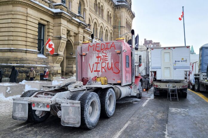 Freedom convoy 2022 in downtown Ottawa, Convoy of freedom. Canadian convoy protest against COVID-19 vaccine. No vaccine mandates Ottawa Ontario, Canada - February 1, 2022